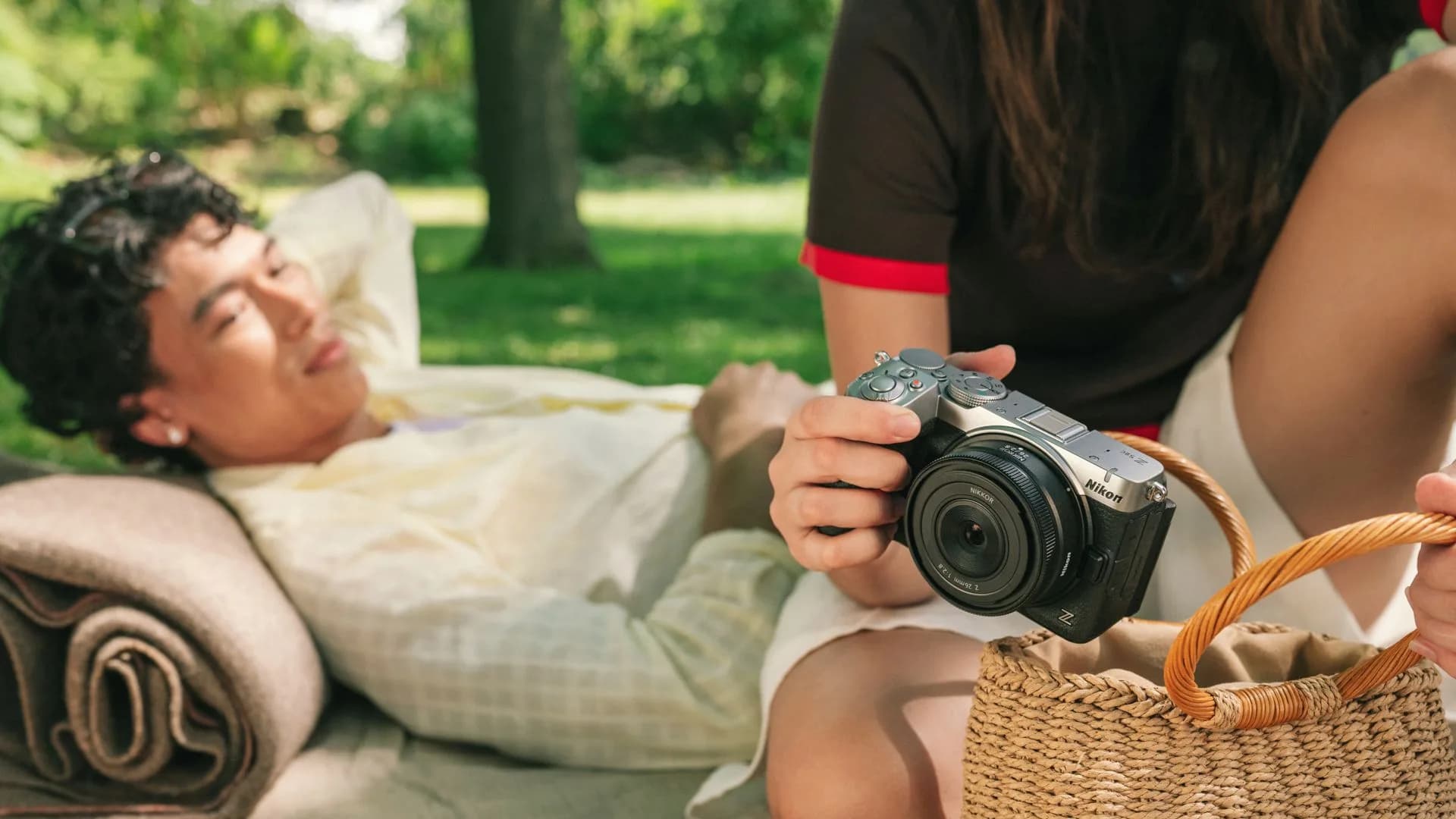 Nikon full-frame mirrorless camera body sitting on a flat wooden surface
