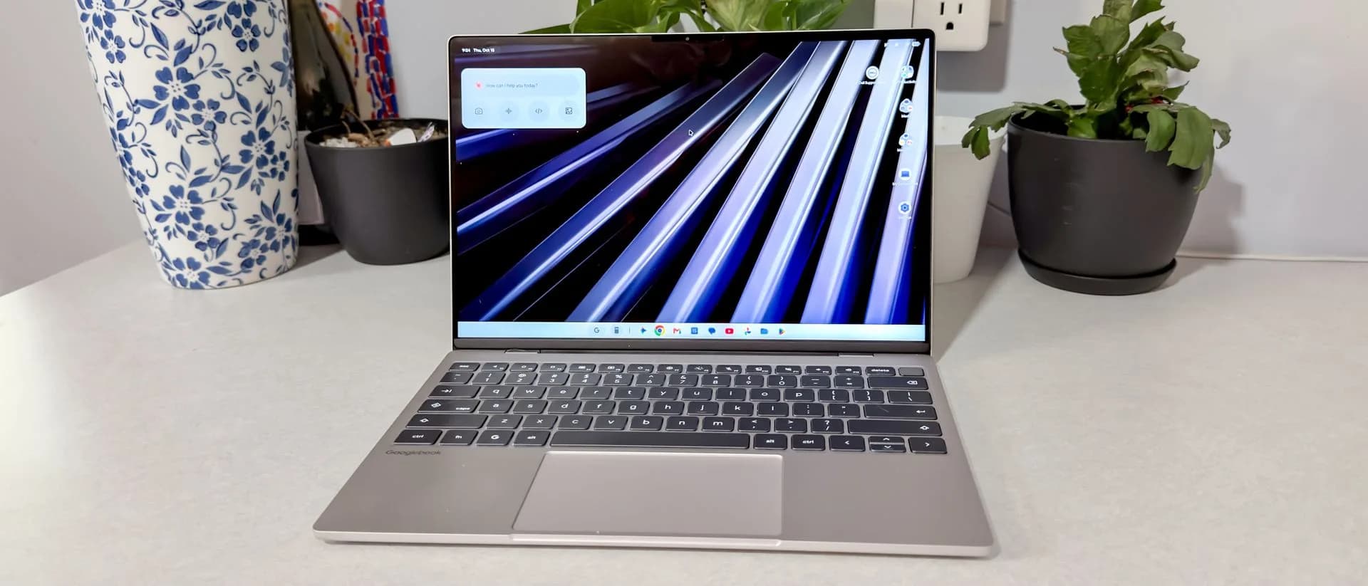 Dell XPS Googlebook in Shimmer silver, open, showing 2.5K touchscreen and Glowbar lighting