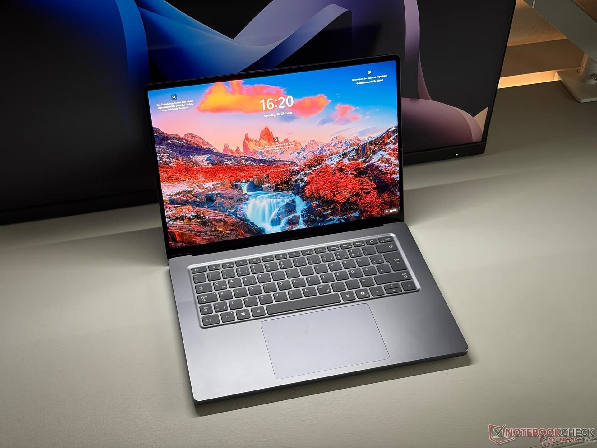 A Microsoft Surface Laptop Ultra open on a desk showing its Mini-LED display and keyboard.