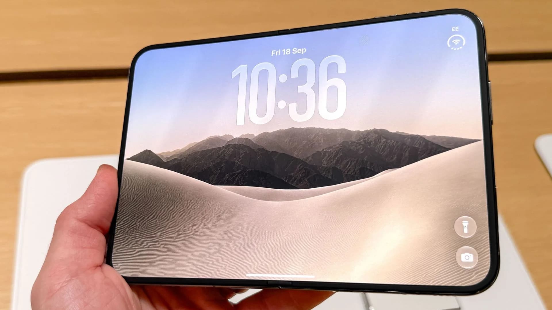 iPhone Duo folded and unfolded side by side, showing outer cover screen and inner main display