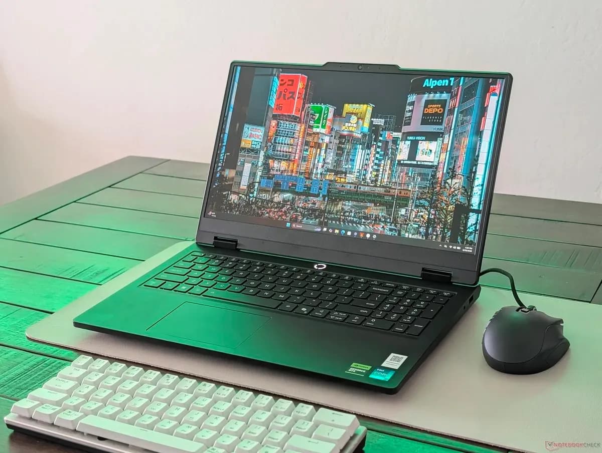 Lenovo LOQ Essential gaming laptop open on a desk showing keyboard and display