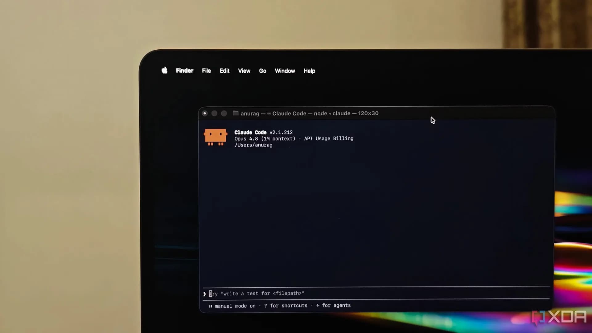 A laptop screen split between a code editor and a terminal running an AI coding assistant