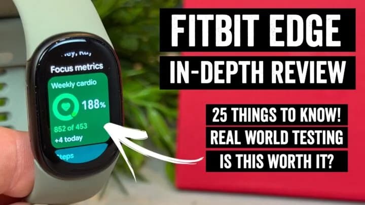 A Fitbit Edge fitness tracker with a black aluminum case and black band on a wrist.