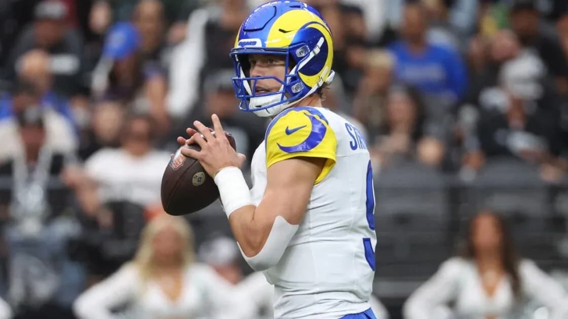 NFL football on a stadium field with Los Angeles Chargers and Rams branding