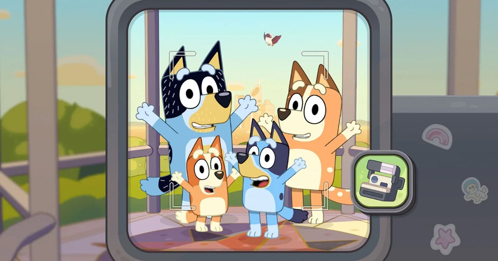 Digital artwork of animated characters Bluey and Bingo holding a toy camera outdoors.