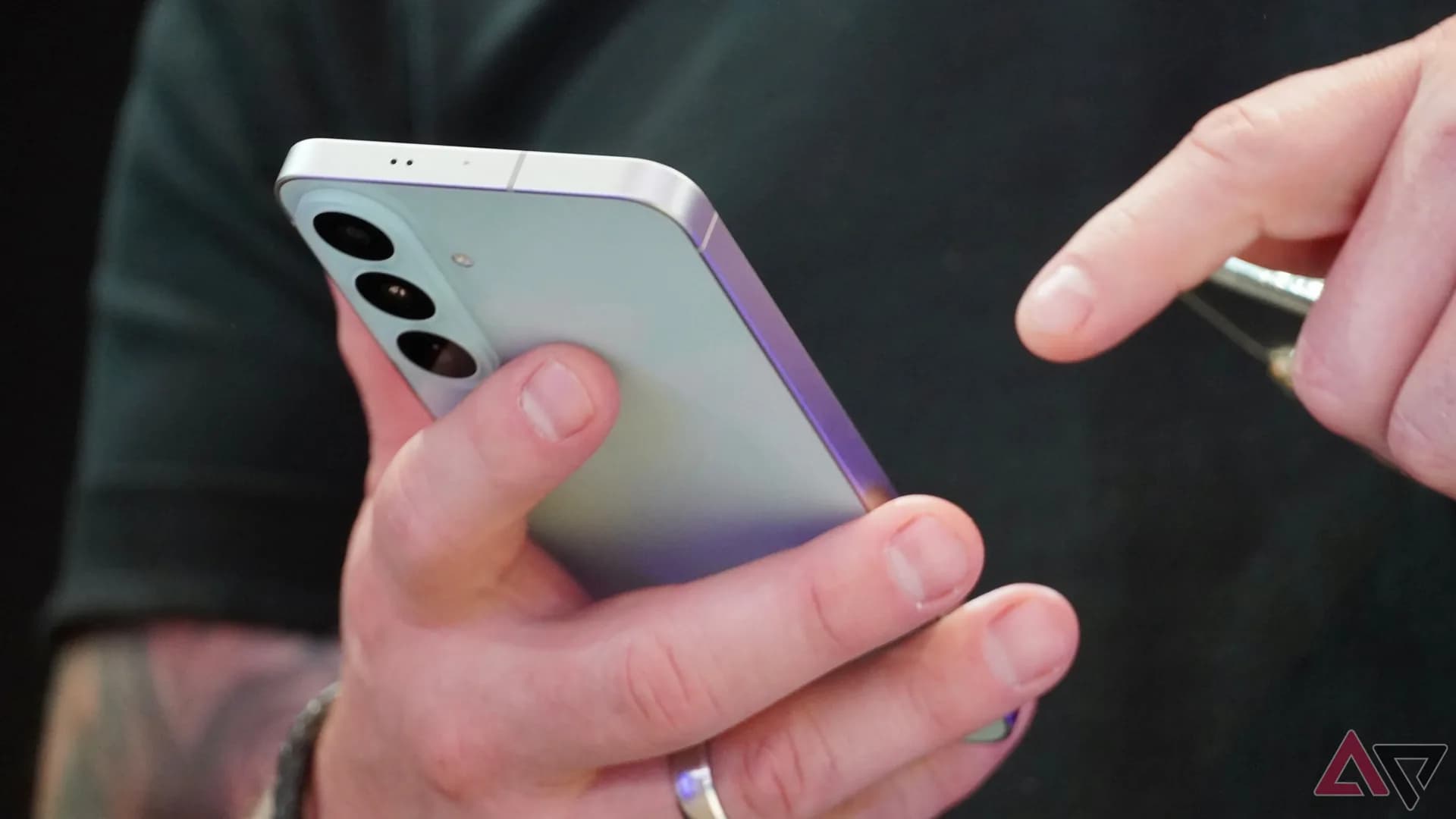 Samsung Galaxy S26 FE smartphone shown with its rear triple-camera module visible