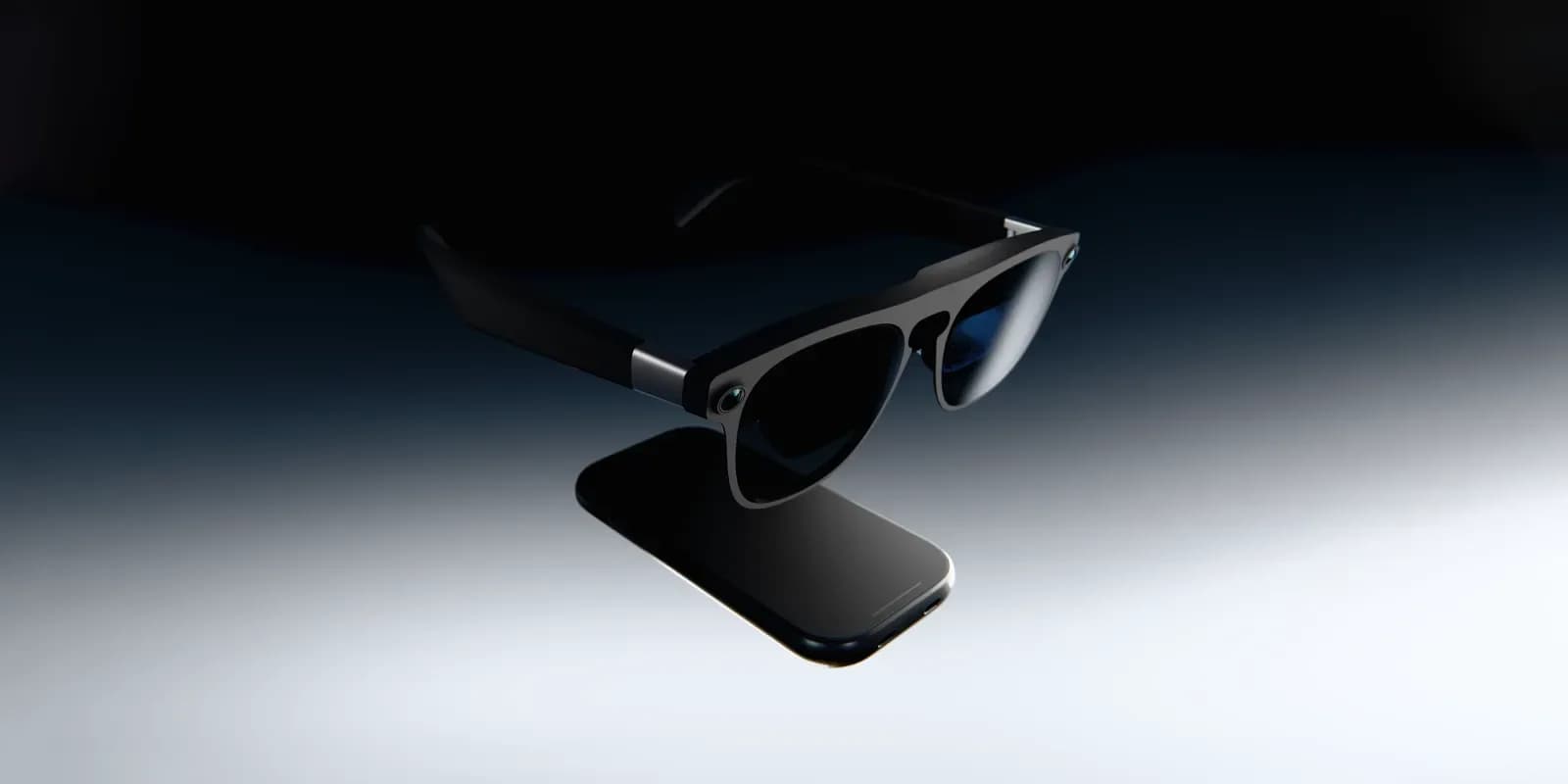 Xreal Aura smart glasses resting beside their connected compute puck controller on a table