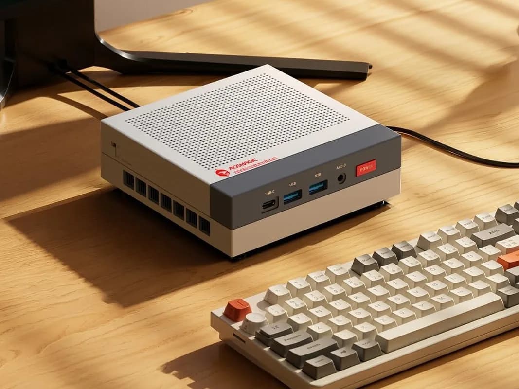 Acemagic X3 mini PC in NES-inspired red-and-grey casing, front USB4 port visible