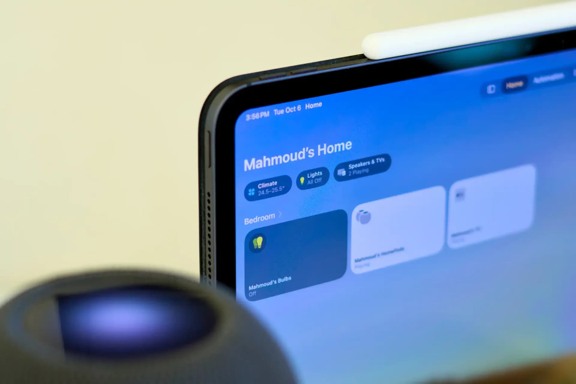 Apple TV box and Siri Remote resting on a dark wooden media console