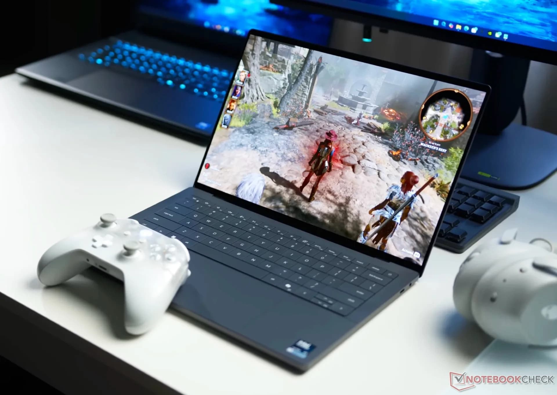 Dell XPS laptop open on a table showing its webcam bezel and keyboard
