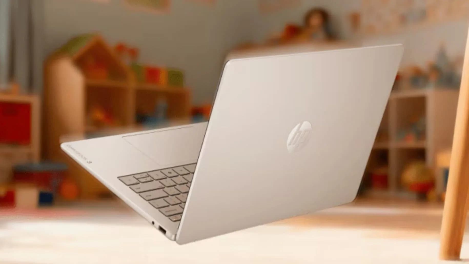 HP Omnibook 3 laptop with a 14-inch OLED touchscreen open on a desk