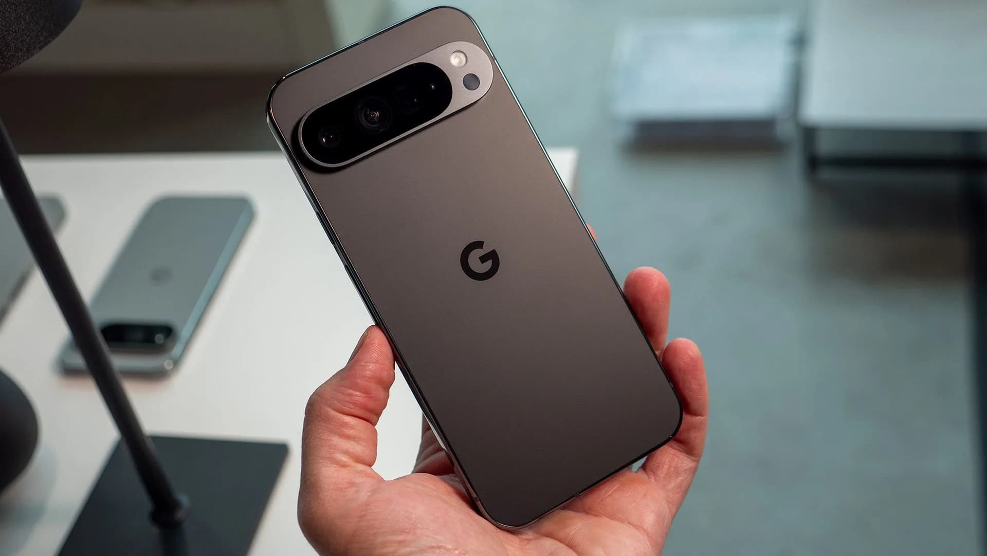 Google Pixel 9 and Pixel 9 Pro smartphones placed side by side on a flat surface