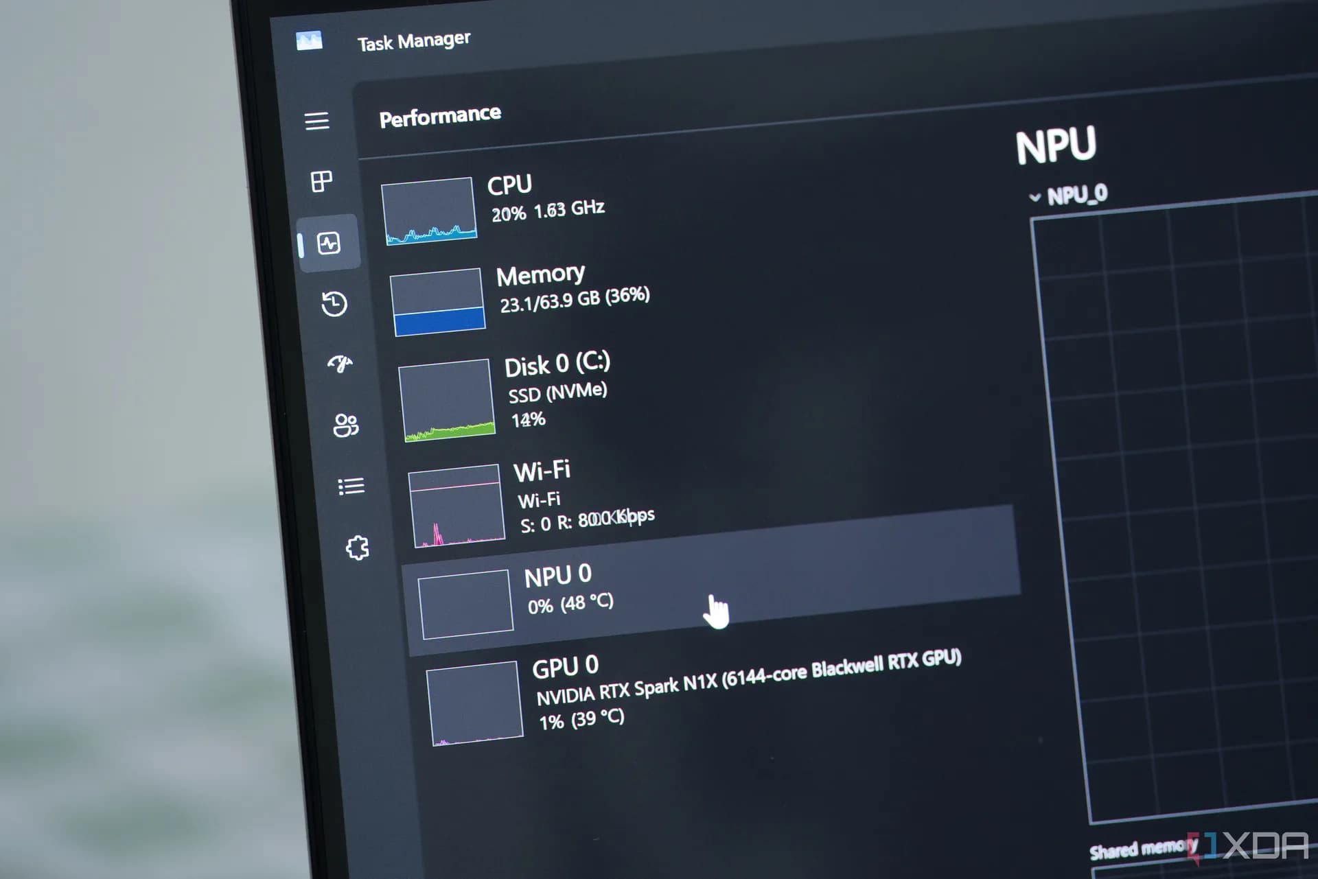 Nvidia RTX Spark mini PC on a desk next to a monitor