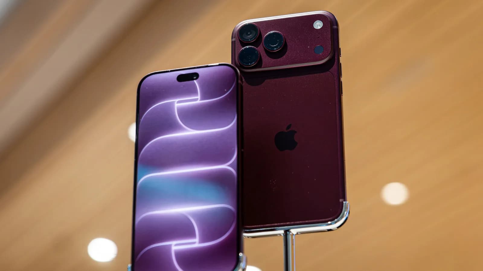 Two iPhone 18 Pro devices side by side showing differing display color tones