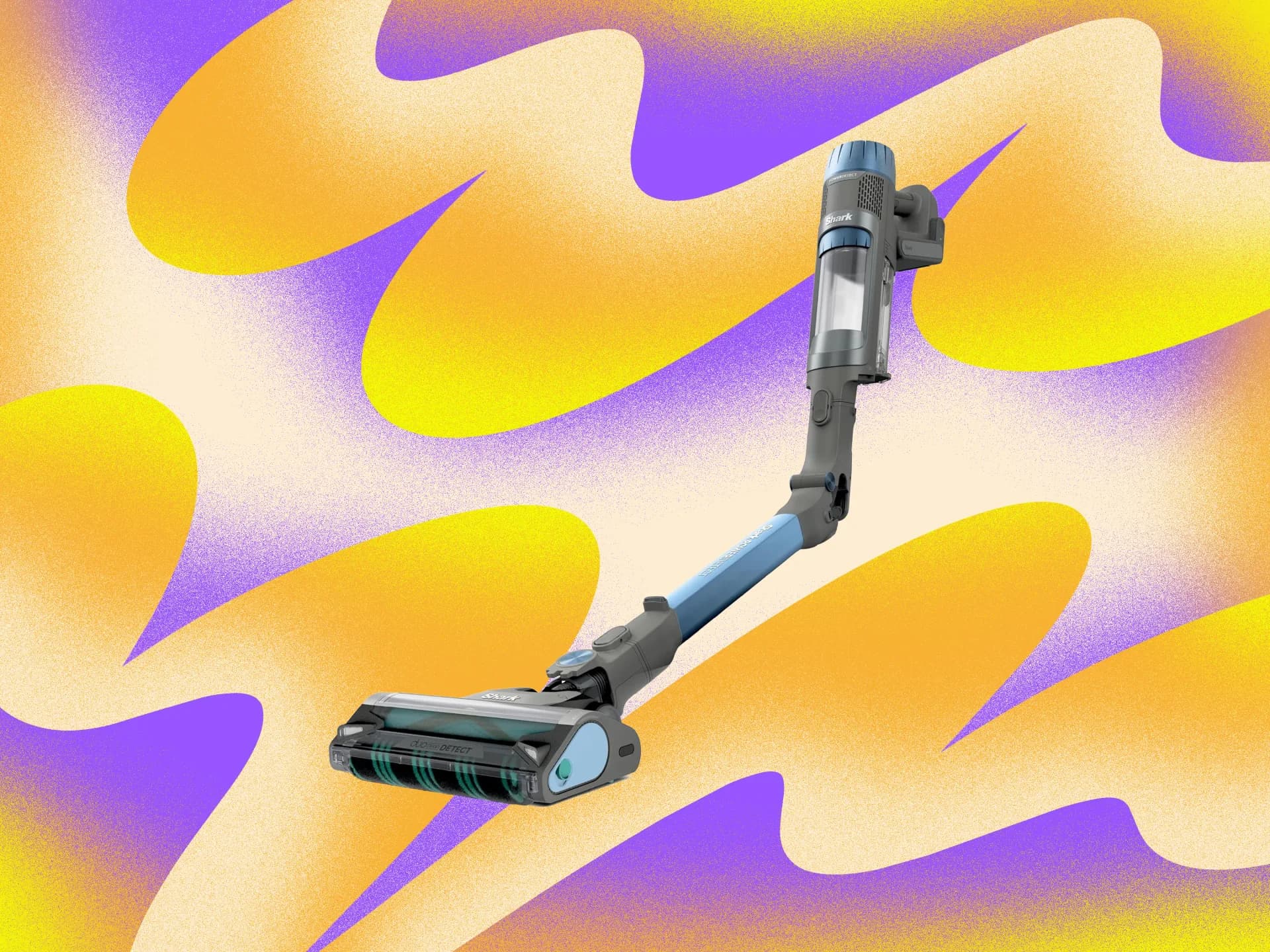 A Shark robot vacuum cleaning a hardwood floor next to an upright Shark stick vacuum