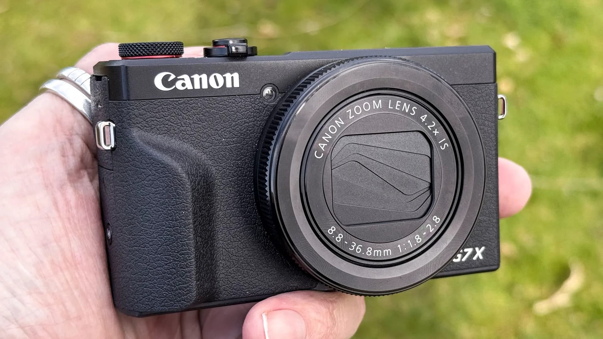 A Canon PowerShot G7 X Mark III compact camera on a plain background