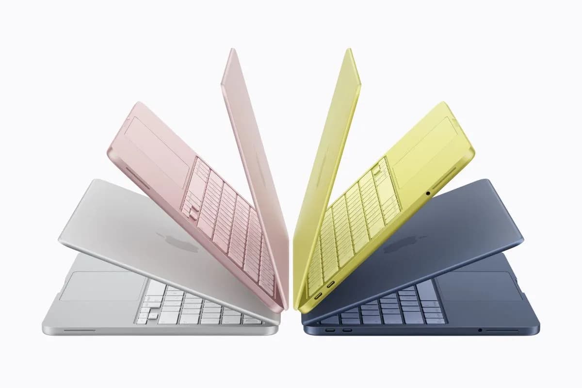 Four devices — MacBook Neo, Lenovo IdeaPad Slim 3, Redmi Turbo 5, Samsung Galaxy S26 FE — arranged on a clean white surface with Amazon Great Indian Festival branding visible in the background