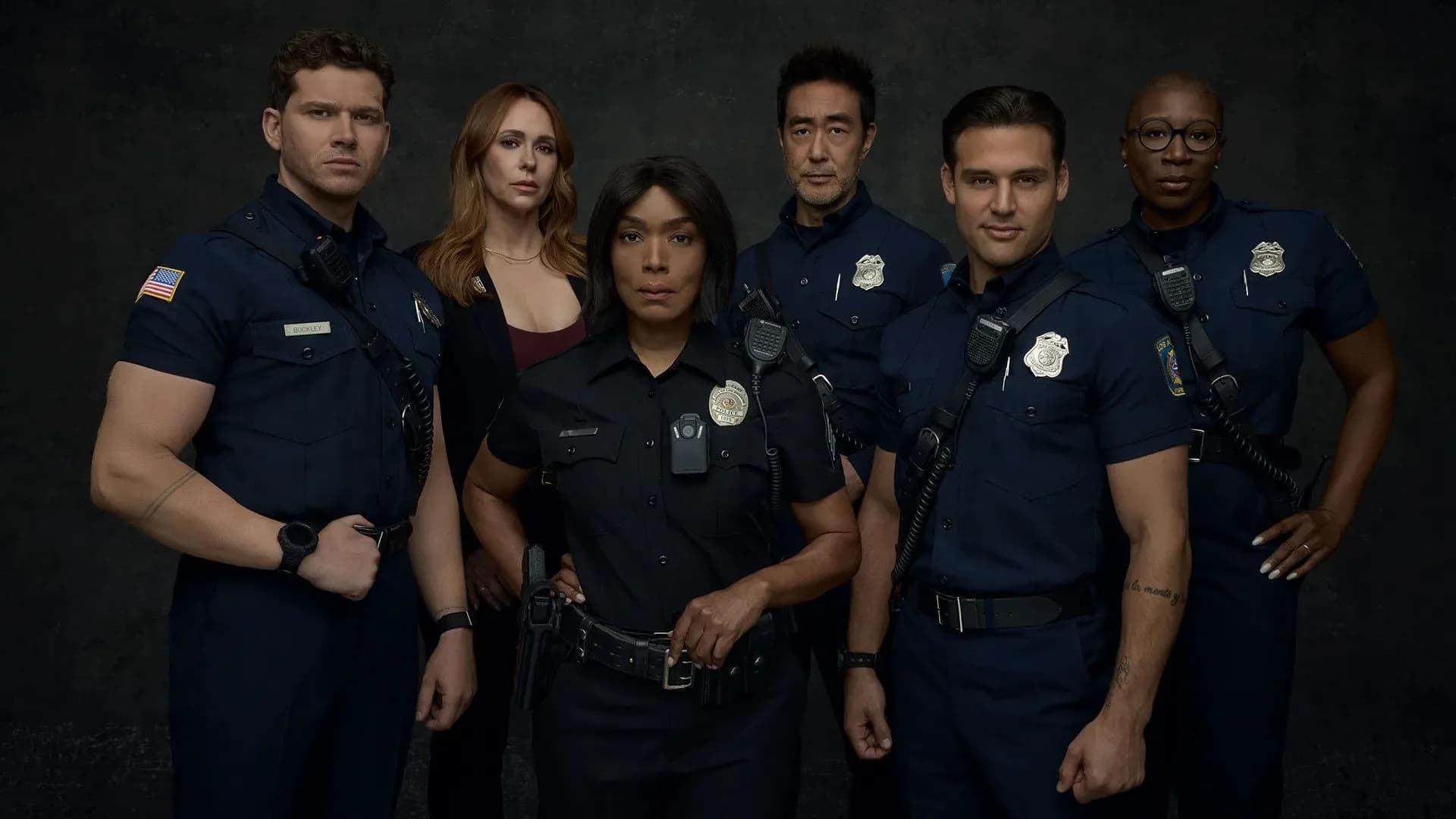 9-1-1 Season 10 promotional still showing firefighters and paramedics in action against a backdrop of smoke and emergency lights