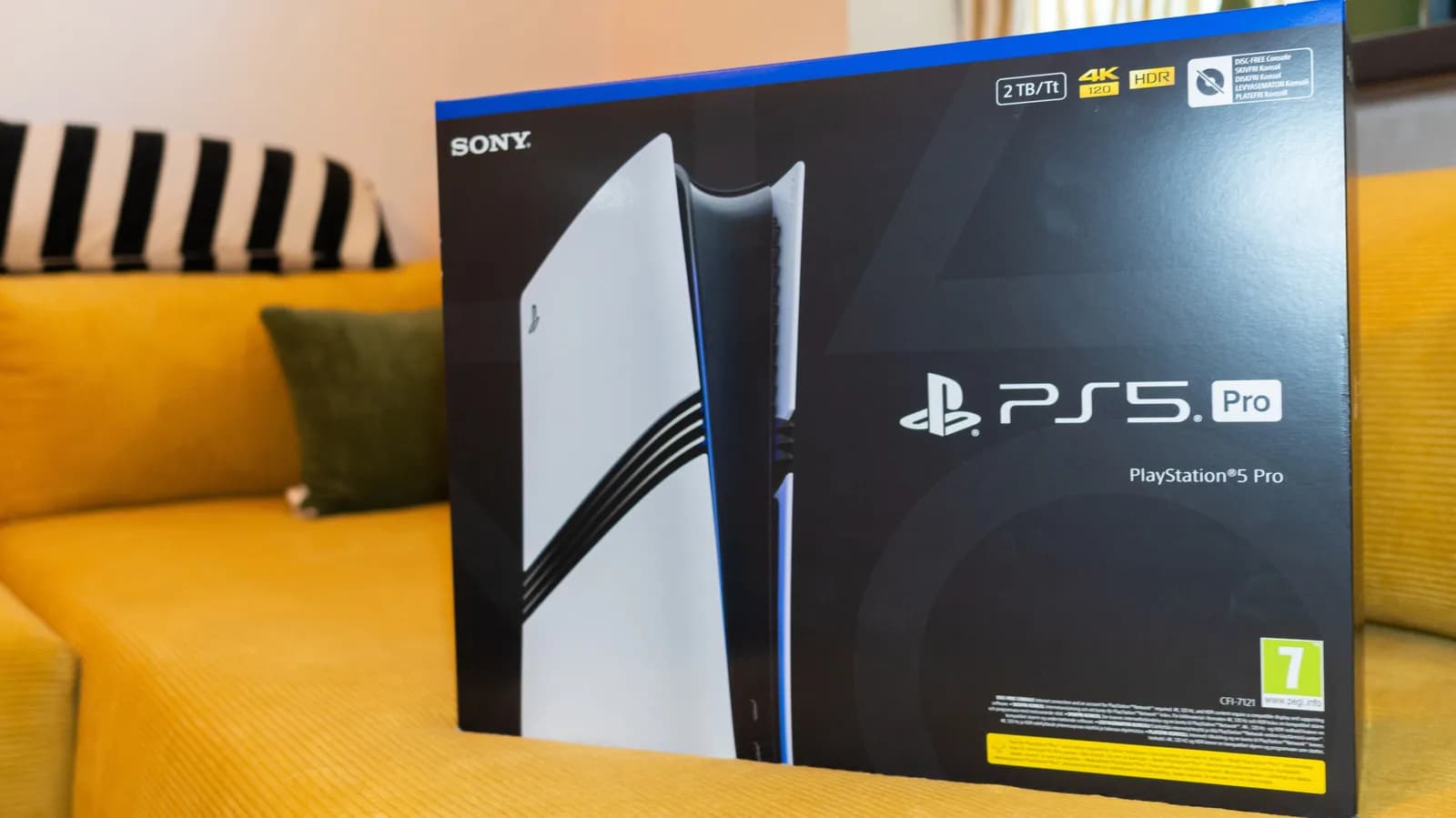 Sony PlayStation 5 Pro console placed alongside the detached modular optical disc drive accessory