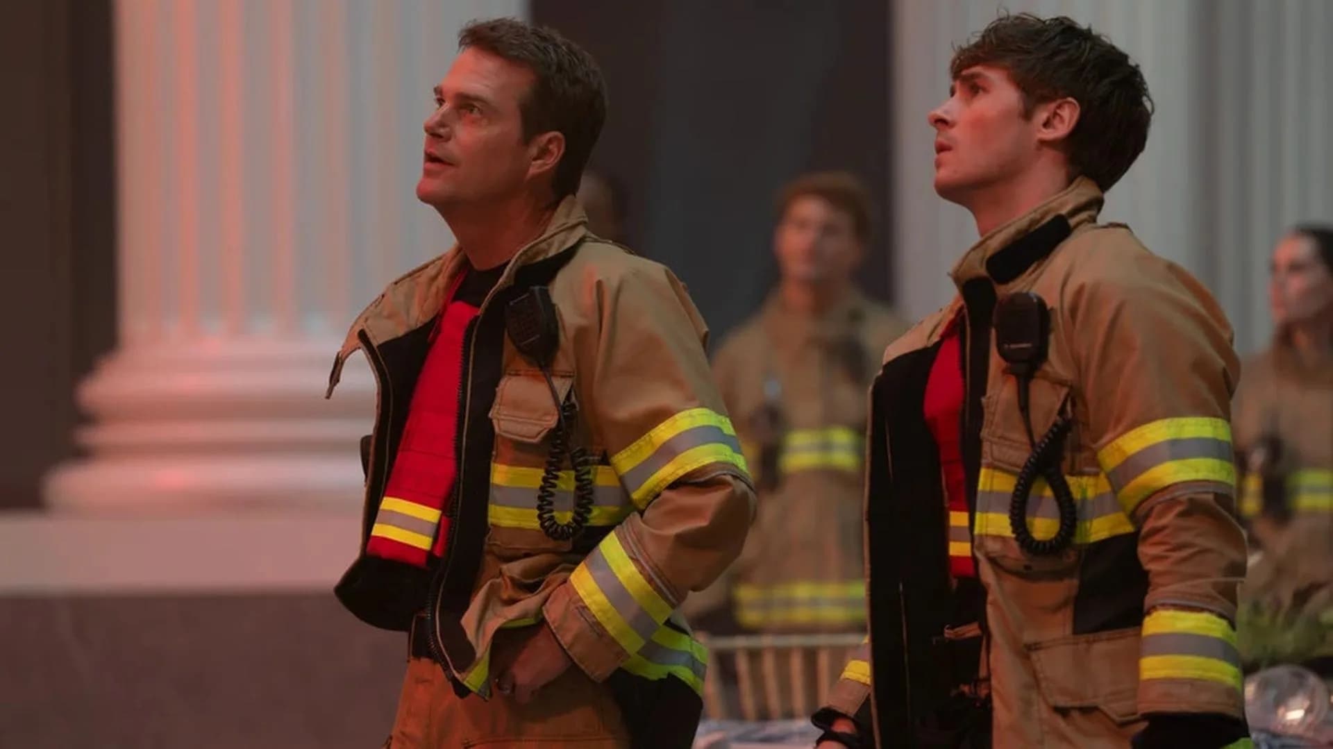 9-1-1: Nashville Season 2 promotional still showing Ryan Philippe as Detective Rouge Kelly standing outside a neon-lit Nashville precinct