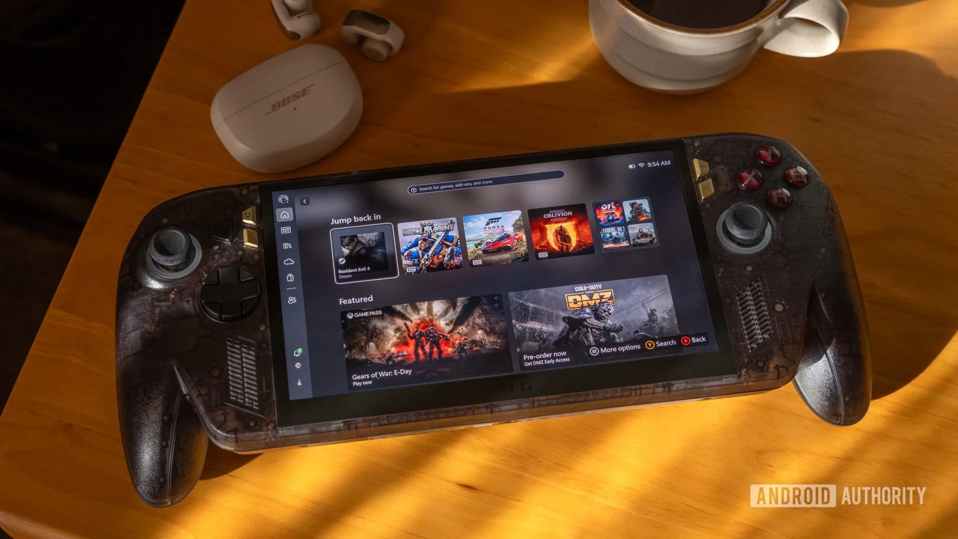 ASUS ROG Xbox Ally X20 handheld gaming PC with transparent shell and OLED screen displaying an Xbox interface