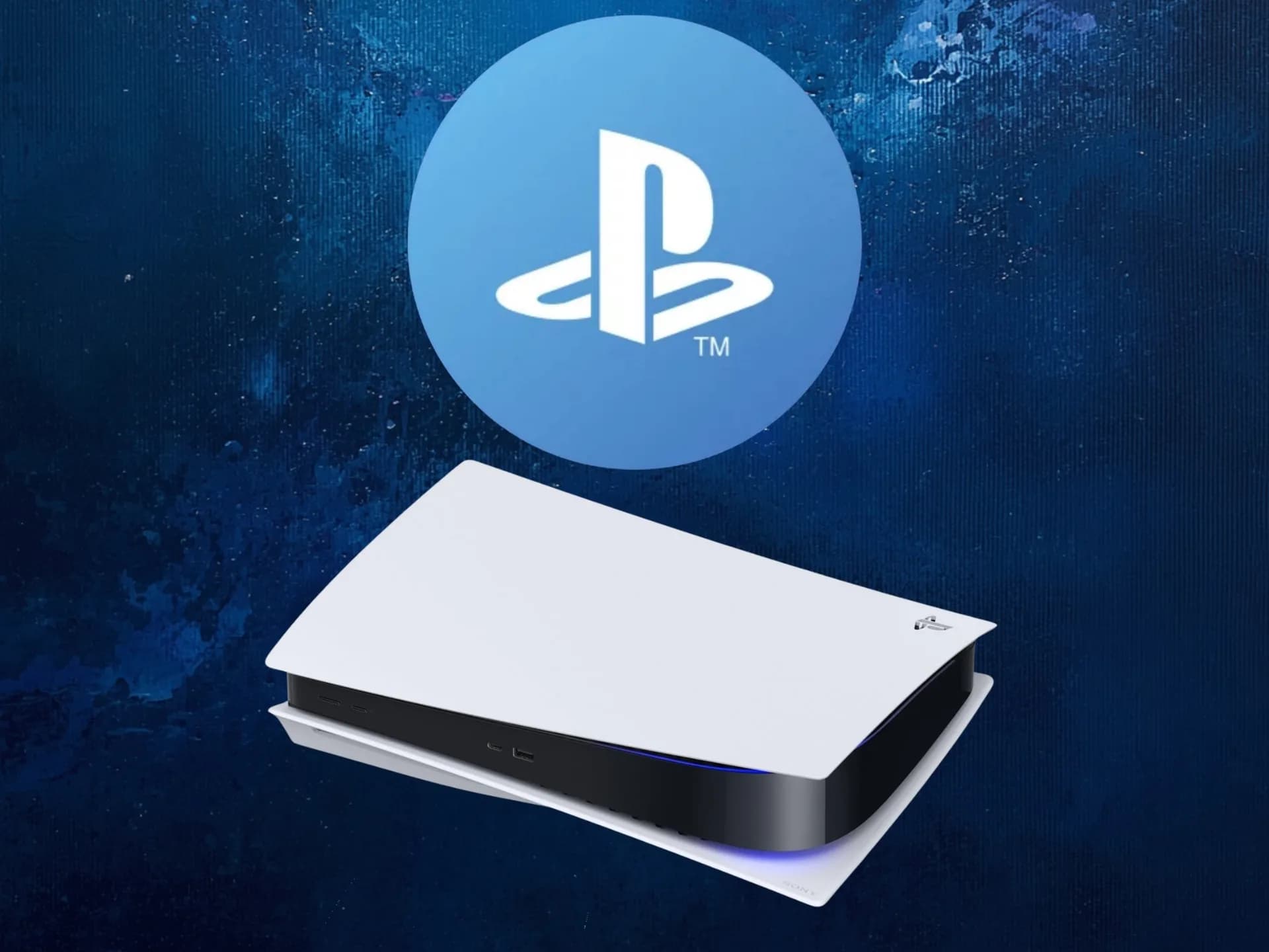 A black PS5 console with blue LED lighting, shown from above on a matte grey surface