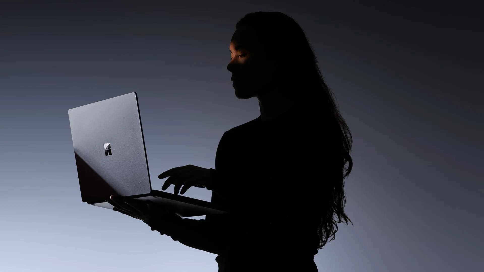 Microsoft Surface Laptop Ultra in matte black, open, showing keyboard and screen