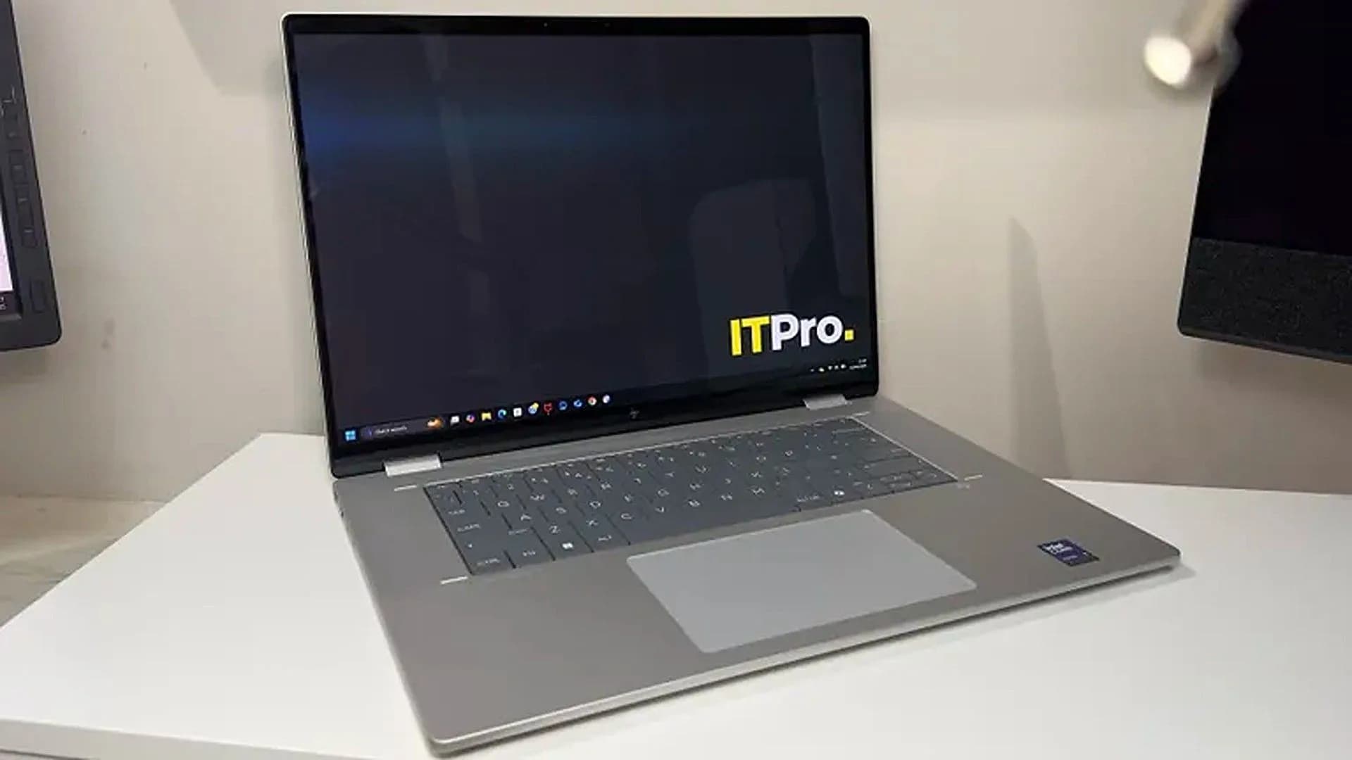 HP Omnibook X Flip 2-in-1 in laptop mode, showing slim bezels and OLED display