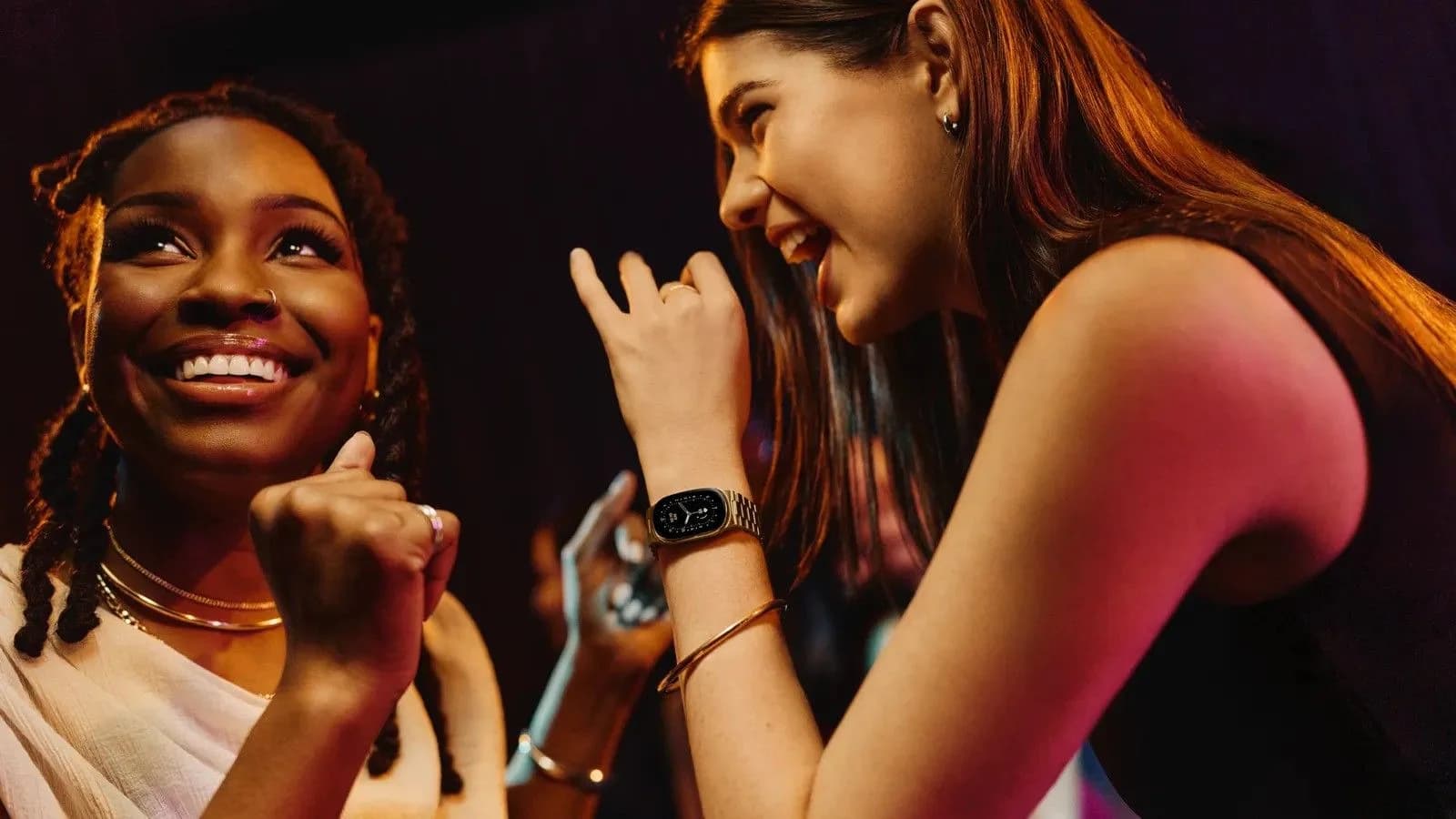 Fitbit Edge front-on, showing slim band and rounded OLED display