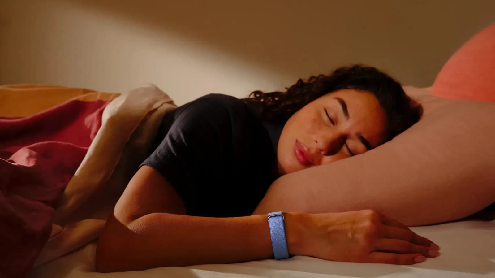 Google Fitbit Air on a wrist beside a pool