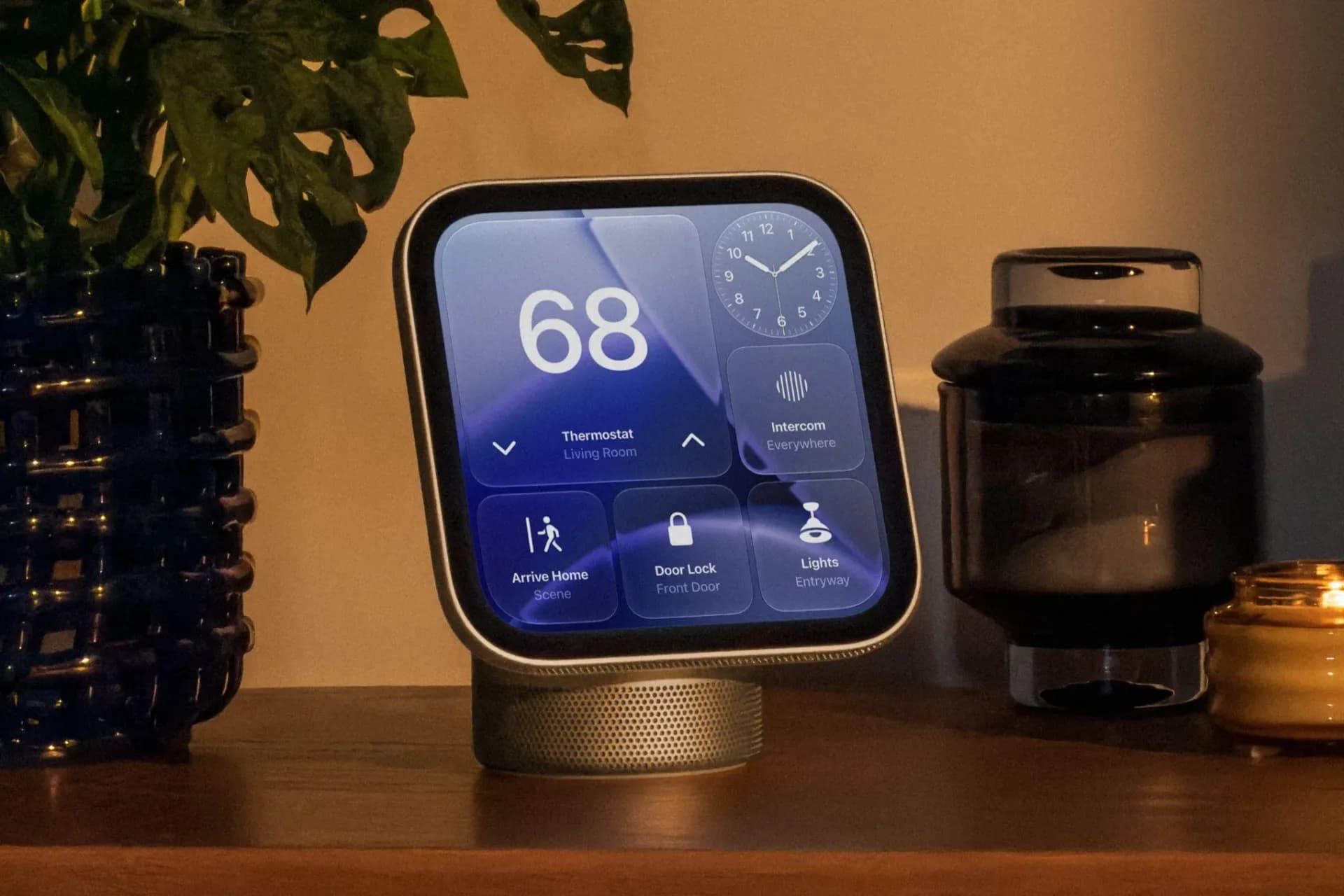 Apple HomeView smart display in starlight color, mounted on a wall beside a countertop