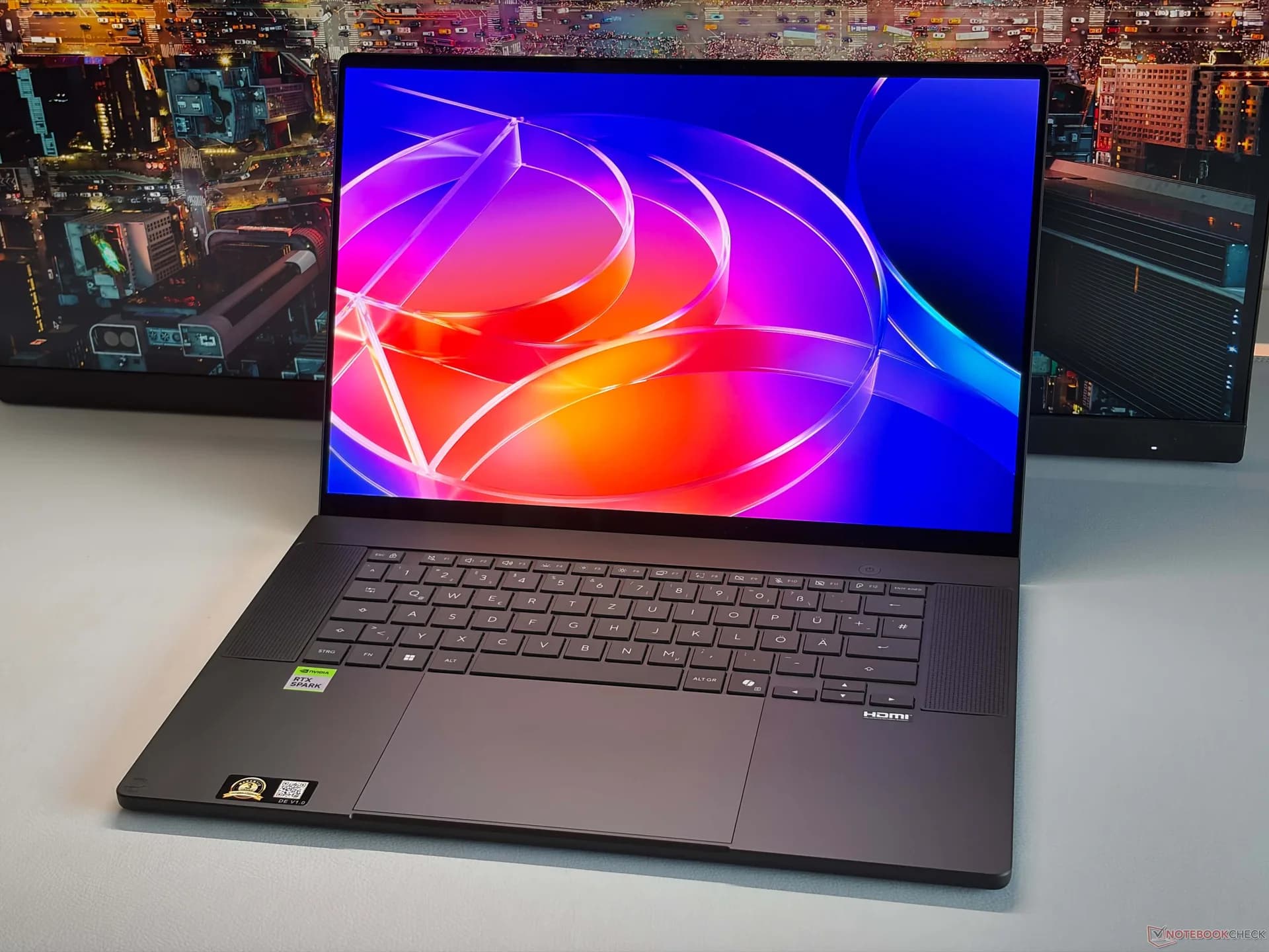 Asus ProArt P16 RTX Spark laptop shown open, displaying a color-graded video timeline and AI model interface