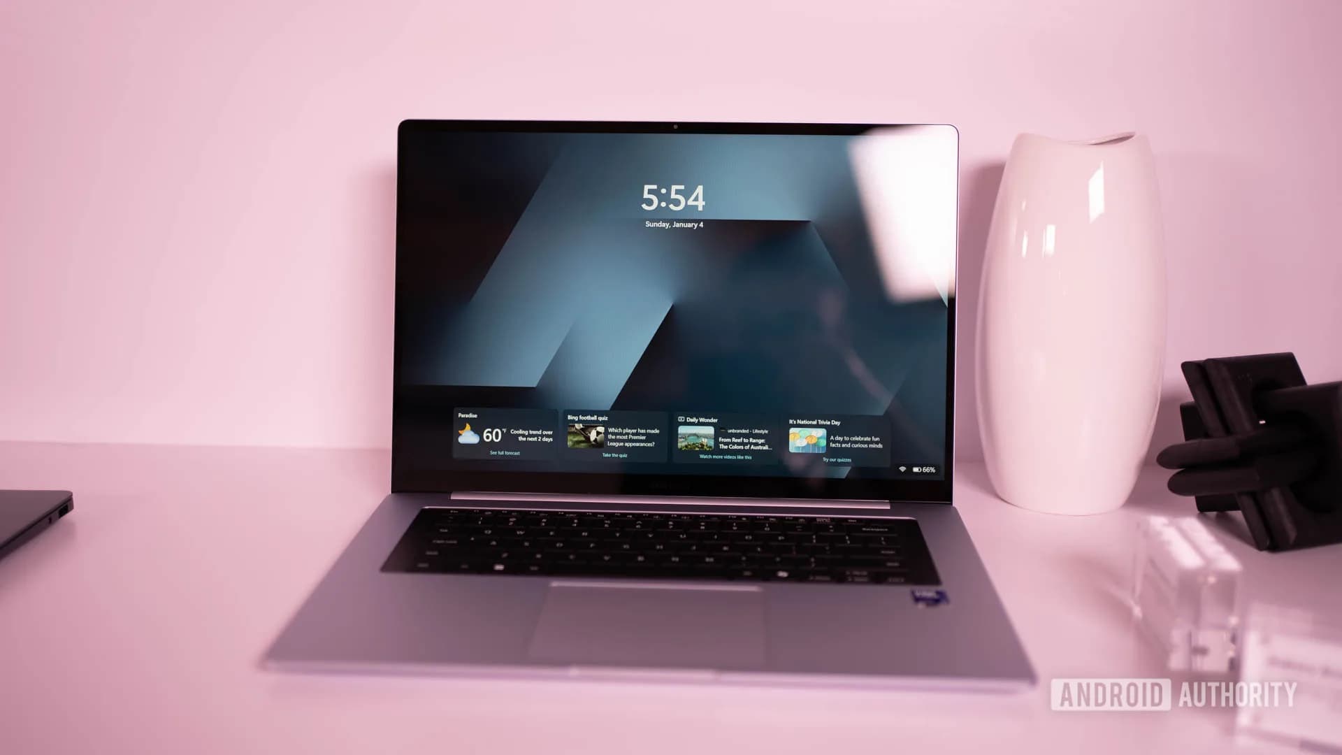 Angled view of a silver Samsung Galaxy Book 6 laptop open on a desk showing its 16-inch display